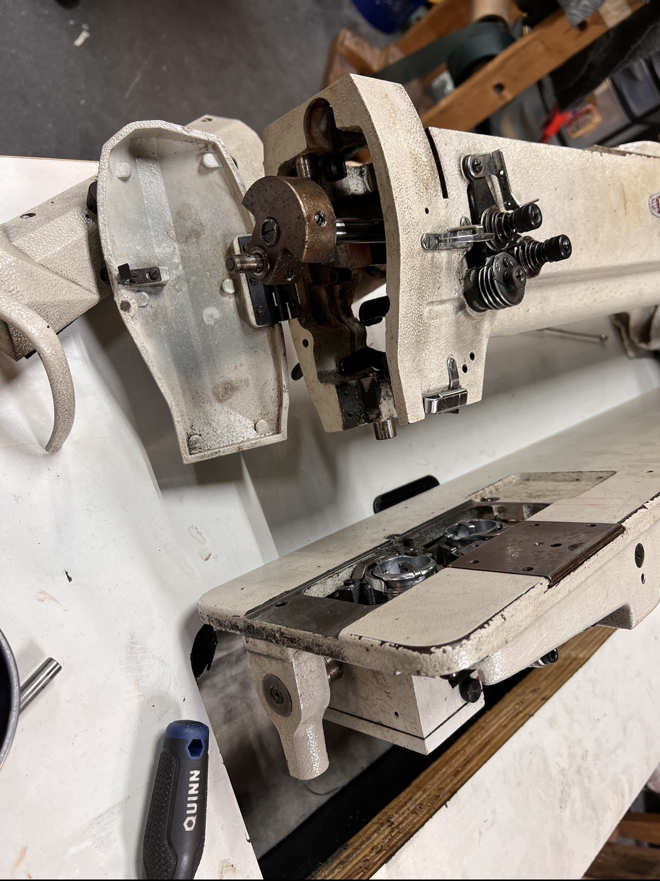 Adjustment of presser foot pressure on industrial sewing equipment