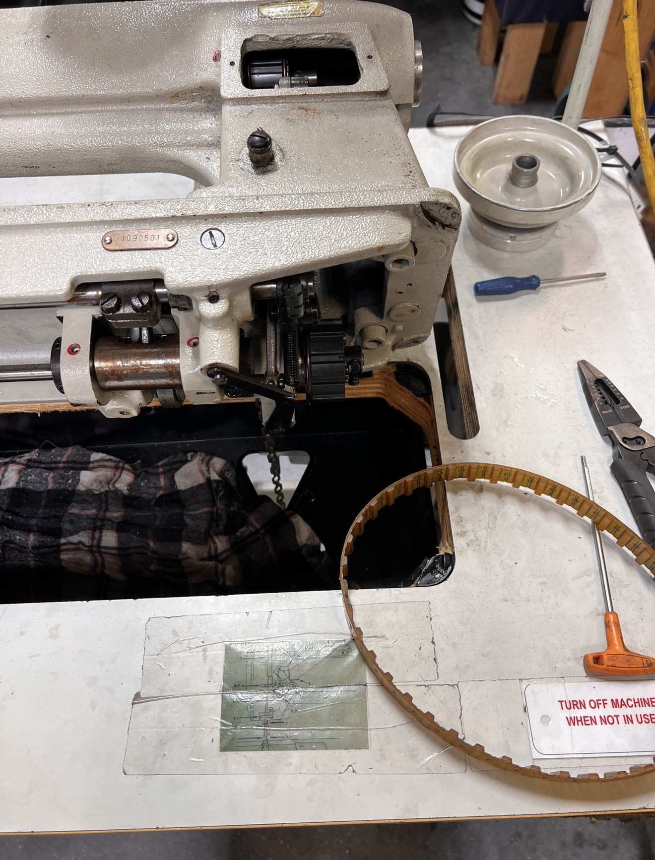 Precision calibration of industrial embroidery machine heads