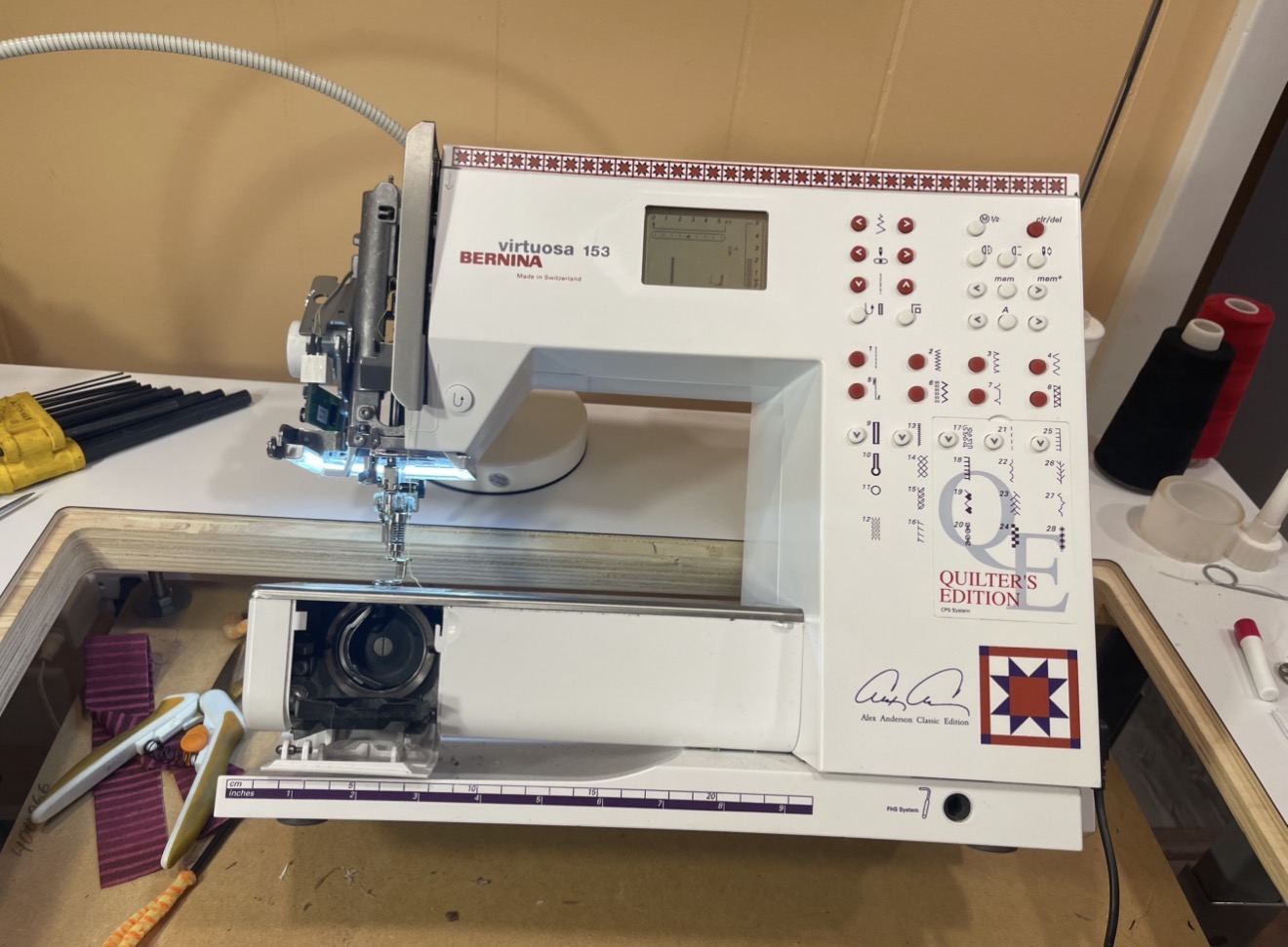 Mobile sewing machine technician adjusting industrial equipment timing